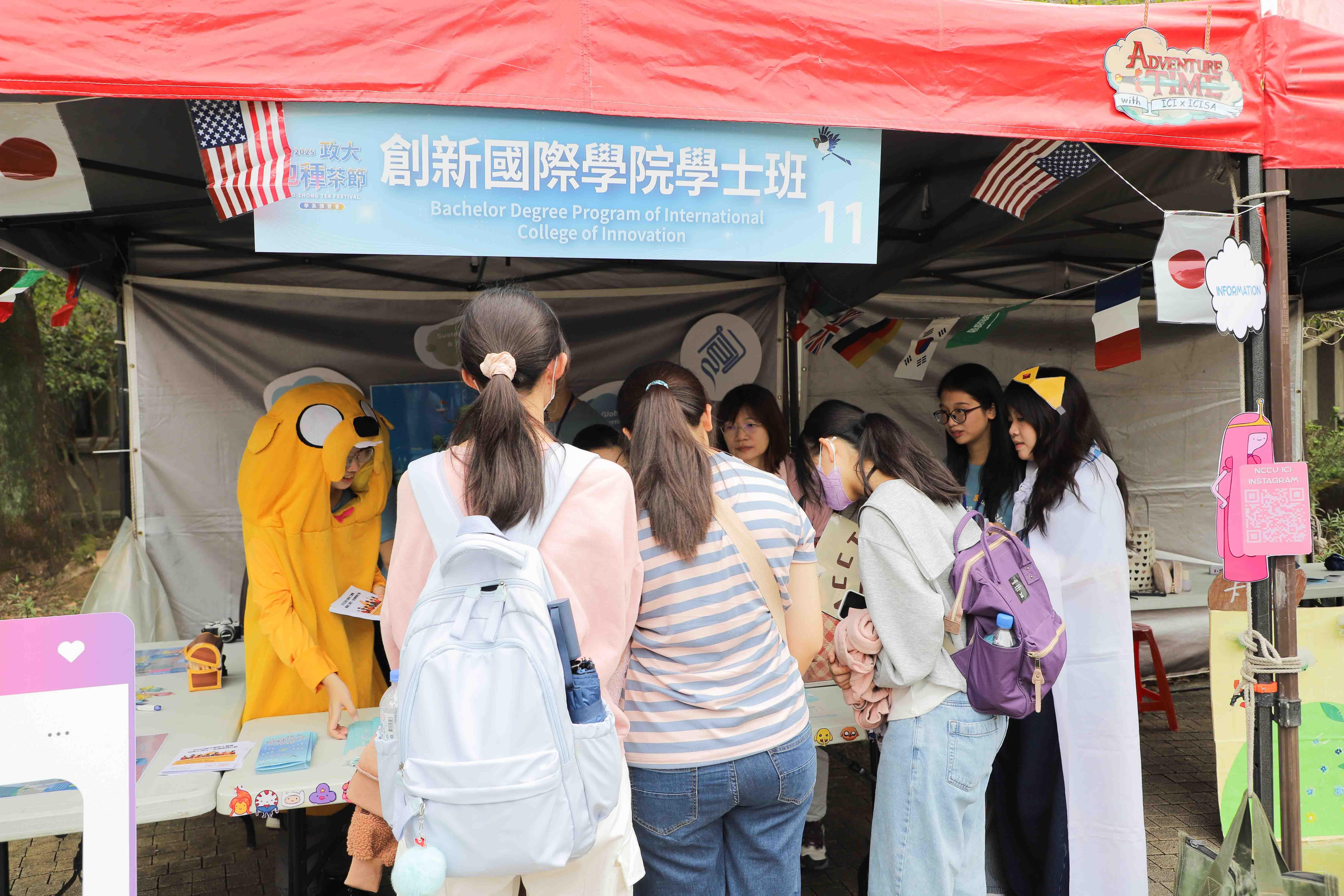 ICI students introducing the college’s programs and features at the booth. (Photo credit: ICI)