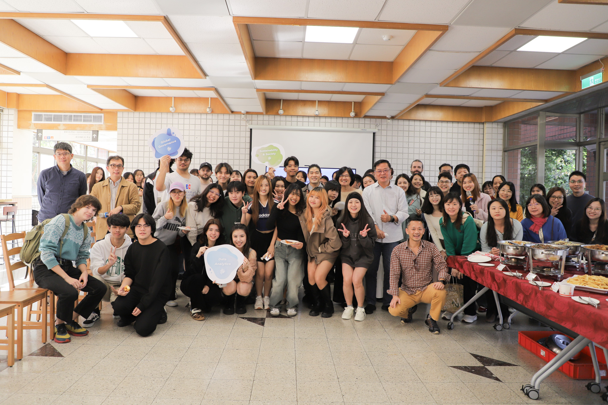 Dean Tu poses for a group photo with students at the ICI Thanksgiving celebration. (Photo by ICI)