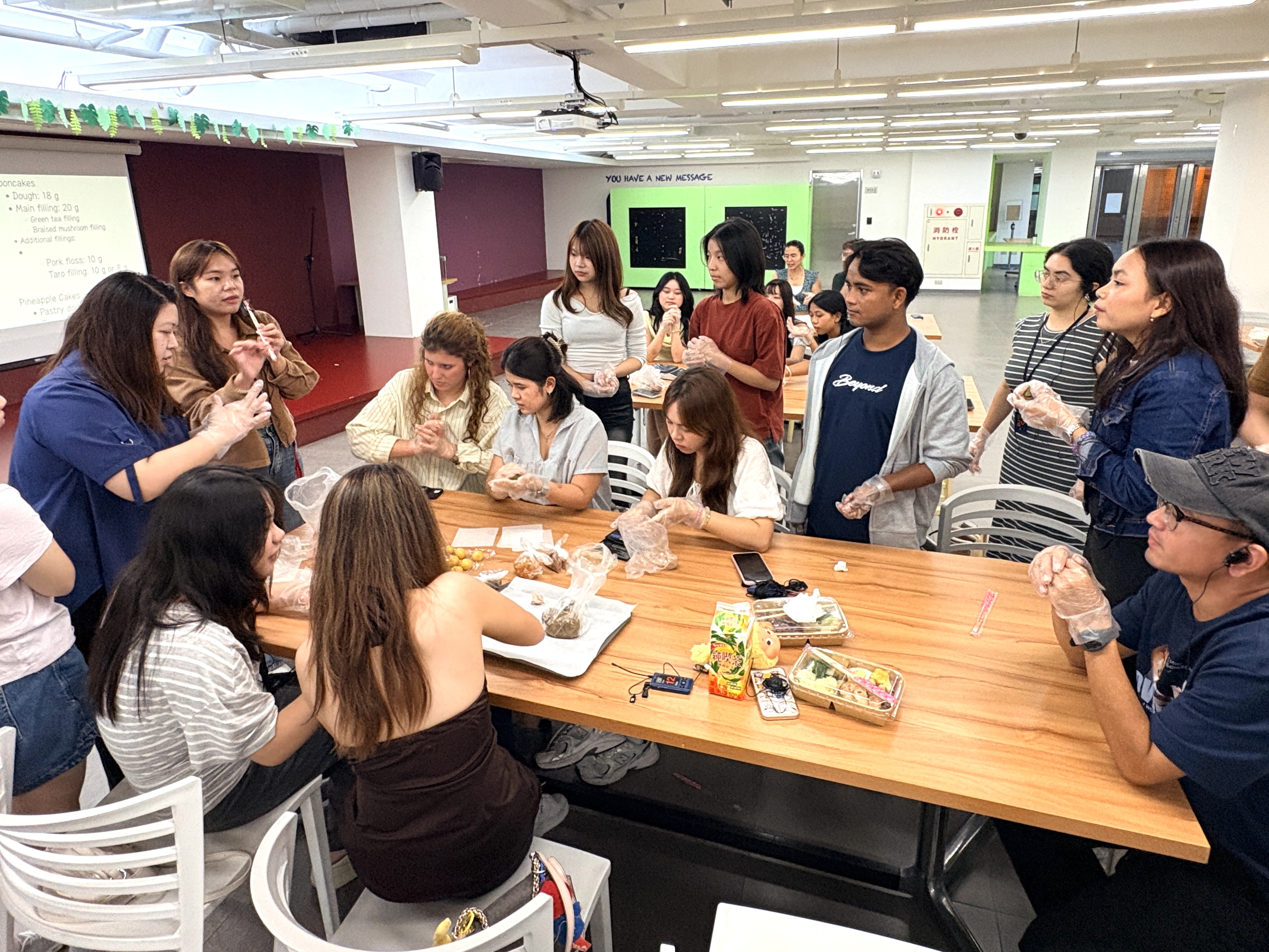 Students learn to shape and fill tea-infused mooncakes while enjoying the fun of traditional festival baking.(Photo courtesy of ICI)