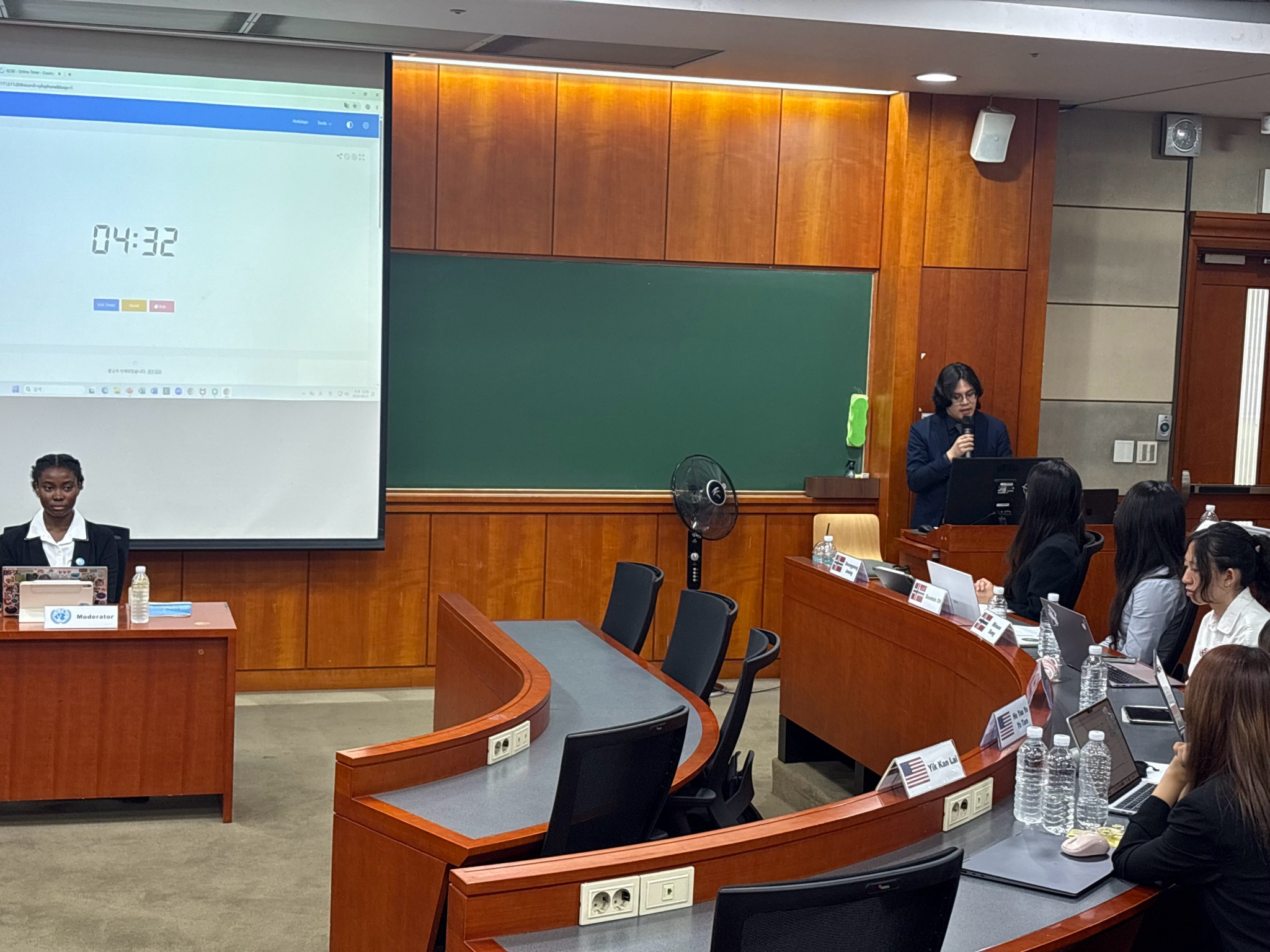 NCCU International College of Innovation fourth-year student Yu-Chen Cheng delivers remarks and presents arguments in English during the simulated Universal Periodic Review. (Photo Credit: Internation