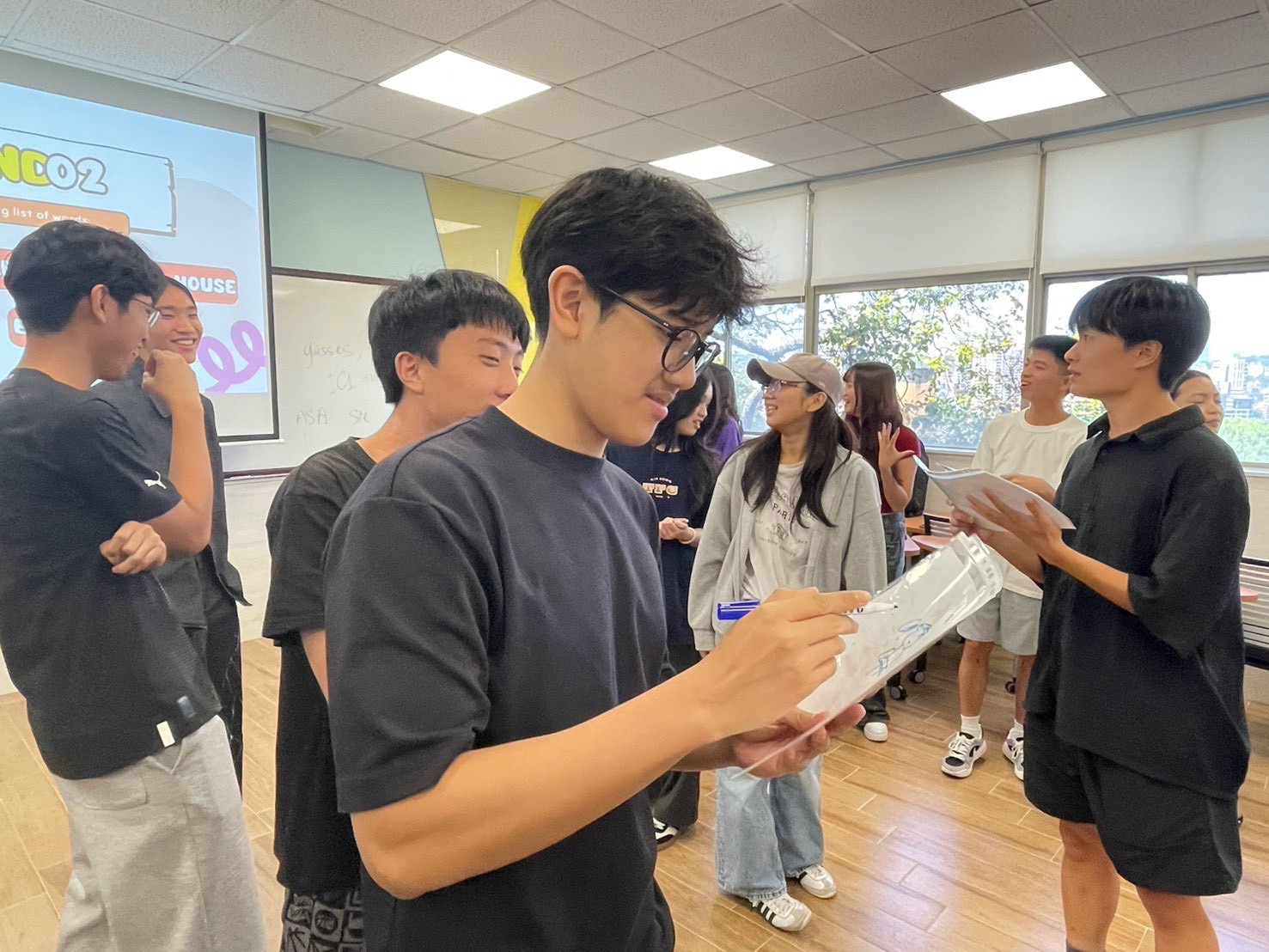 Freshmen from different countries and cultural backgrounds take part in a group game, building connections through laughter and interaction. (Photo courtesy of the ICISA)